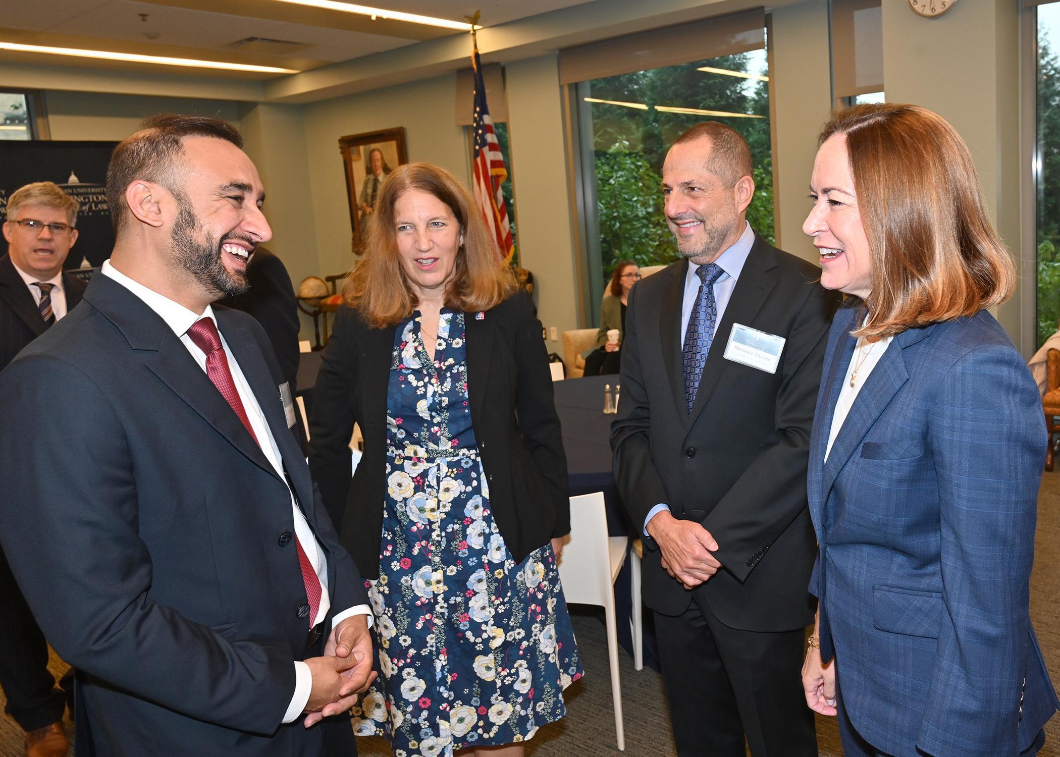 Asst Secretary of State Lee Satterfield, (right) and AU President Sylvia Burwell, speak with a Humphrey Fellow.